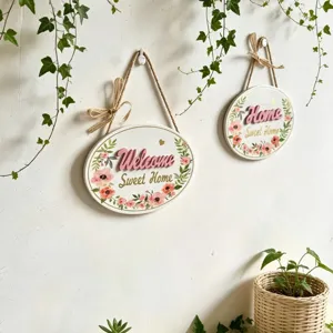 Detailed view of floral oval wooden wall hanging signs with Welcome Sweet Home text