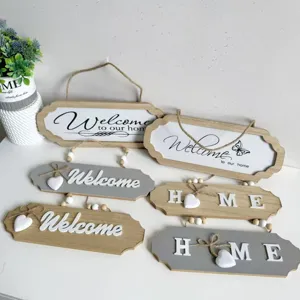 Assorted vintage wooden welcome and home wall hanging signs with 3D letters and hearts