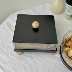 Detail view of the black acrylic dessert display box with natural wooden ball handle