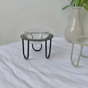 European minimalist dessert display stand with black metal base and clear glass bowl