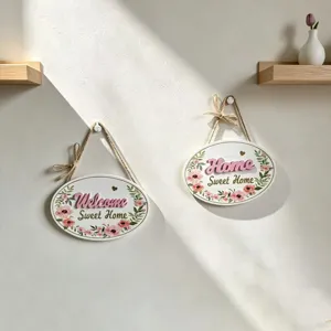 Two decorative oval wooden wall plaques with floral patterns and Home Sweet Home text.