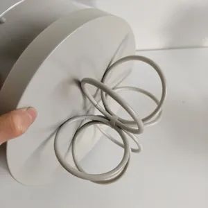 Close-up of the metal support structure of a minimalist grey iron dessert stand