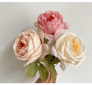 Detailed close-up showing the realistic texture of pink and cream French style artificial roses.
