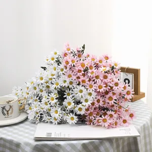 Detailed view of pink and white artificial daisy bouquets used for aesthetic home decoration
