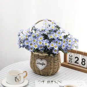 Close-up of blue artificial daisies in a rustic woven basket for elegant home decor