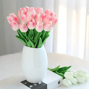Realistic pink and white artificial PU tulips in a white vase for home decoration.