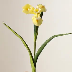 Macro view showing the realistic texture and soft yellow hue of the PU iris flower petals