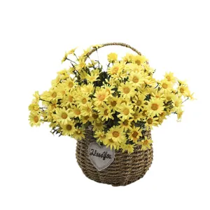 Vibrant yellow artificial daisies in a rustic hand-woven basket for home and photography decor
