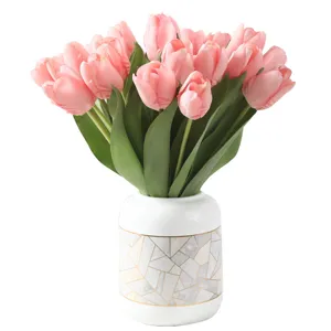 High-end artificial pink tulips in an elegant geometric marble pattern ceramic vase
