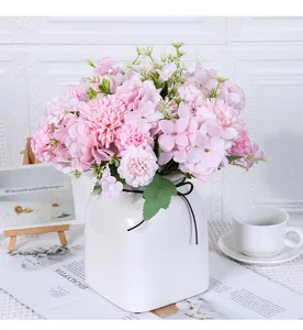 Elegant artificial pink flower bouquet in a white square ceramic vase for home decor