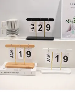 Detailed macro view of white, black, and natural wooden perpetual flip calendars