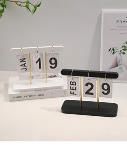 Detail view of creative wooden flip desk calendars in black and white minimalist style