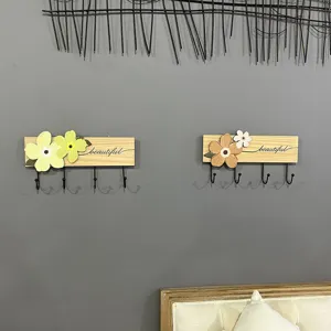 Decorative floral solid wood wall coat rack with four metal hooks for entryway storage