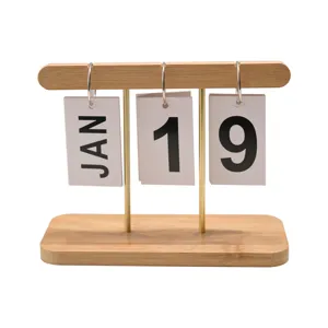 Creative minimalist wooden desk calendar with flipping date cards on white background