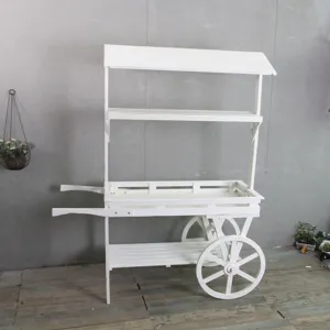 Chariot à fleurs vintage en bois blanc avec étagères pour la vitrine de magasin