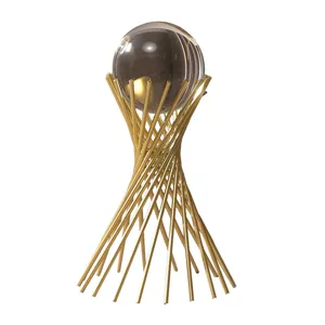Luxurious modern crystal ball ornament with a geometric gold metal stand decor