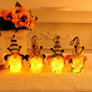 Warm glowing Bee Day gnome plush ornaments set with yellow hats and cute wings