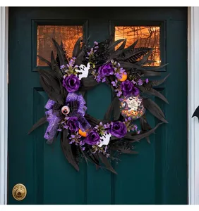 Spooky Halloween wreath with purple roses and ghosts hanging on a dark green door