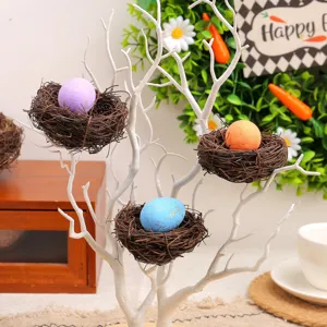 Handcrafted vine bird nests with colorful Easter eggs for seasonal garden DIY decor