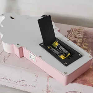 Detailed back view of pink wooden ice cream lamp showing battery compartment and switch