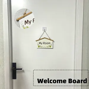 Detail of a pastoral style wooden hanging sign with 'My Room' and floral design.