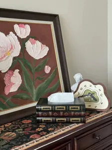 Vintage European style wooden faux book tissue box displayed on an elegant dresser