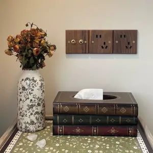 Vintage wooden tissue box designed as a stack of antique books in a retro room