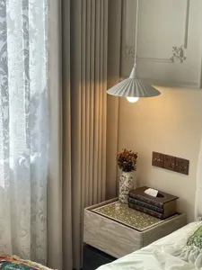 Detailed view of vintage book-shaped wooden tissue box on a cozy bedside table