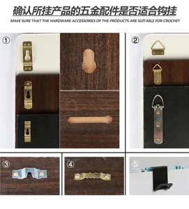 Detailed view of various mounting hardware for photo frames including hooks and brackets