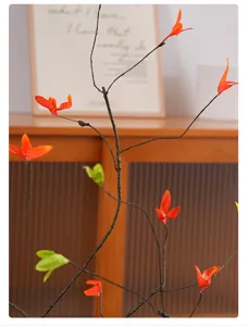 Detailed close-up showing the realistic texture of artificial dry branches with orange leaves
