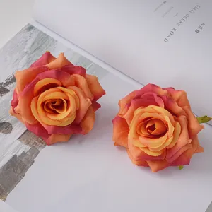 Curled edge artificial rose heads in vibrant orange and pink gradient silk cloth