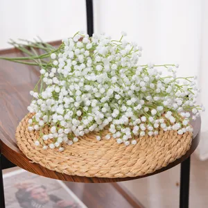 Elegant white artificial baby's breath bouquet for wedding decor on wooden table