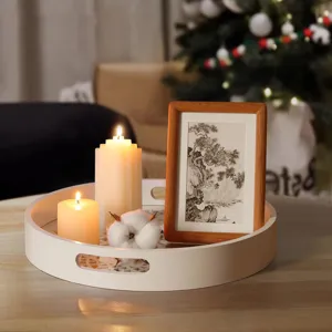 Nordic white wooden hollow serving tray with candles, minimalist home decor detail shot.