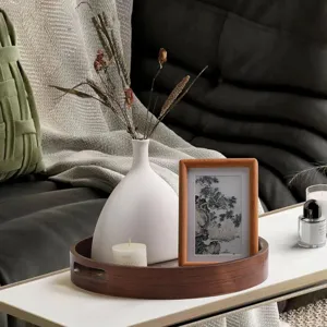 Wooden round tray with cutout handles, Nordic style decorative storage plate for home detail view.