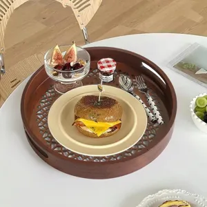 Nordic wooden serving tray with hollowed design, elegant round decorative tea and snack platter.