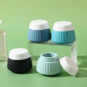 Portable silicone travel cream jars with ribbed texture and white screw-on lids