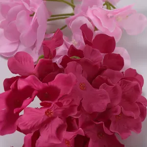 Artificial pink hydrangea and rose flower wall detail for wedding and event decoration background.