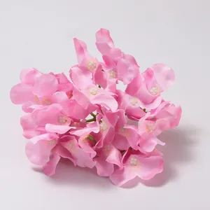 Pink artificial hydrangea flower cluster detail view, soft silk petals for wedding decor