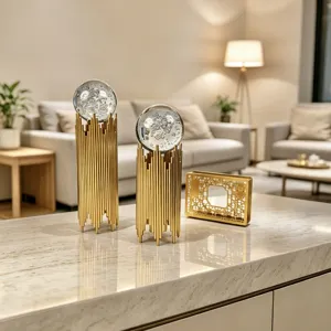 Close-up of golden iron rod stands holding clear crystal balls with bubble textures