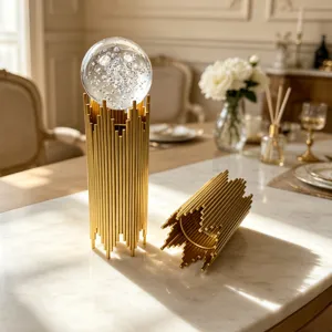 Elegant close-up of light luxury golden iron tube base with a bubble crystal ball ornament
