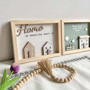 Close-up of Nordic 3D wooden decorative frames with 'Home' themed quotes and houses