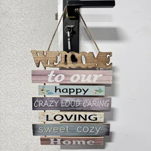 Detailed macro view of a rustic wooden welcome sign hanging with warm home quotes
