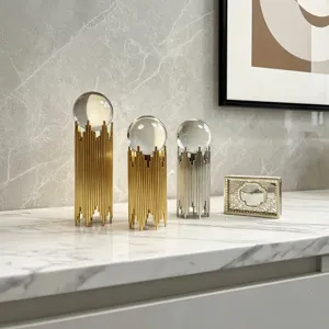 Elegant luxury iron crystal ball ornaments on a white marble table for home decoration