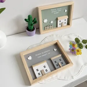 Close-up detail of 3D Nordic wooden shadow box frames with house and heart designs