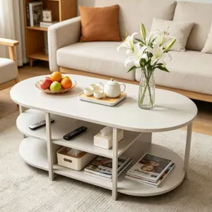 Table basse ovale moderne à plusieurs niveaux en fer crème pour le salon chic