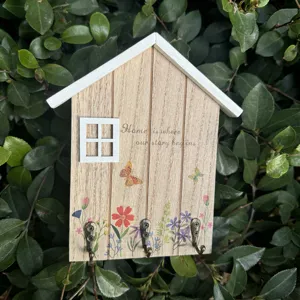 Rustic Nordic style wooden house-shaped key hook with floral prints and home quote