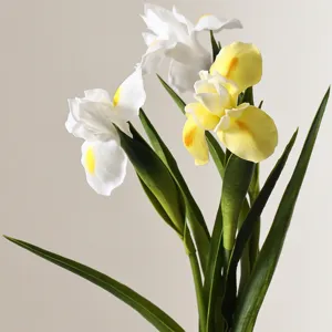 Detailed view of realistic white and yellow PU iris flowers for elegant home decor