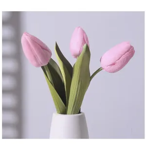 Close-up detail of realistic pink moisturizing tulips in a white ceramic vase