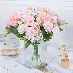 Romantic pink artificial flower bouquet in a clear fluted glass vase for home decor