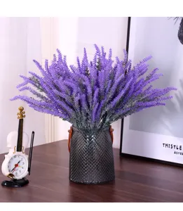 Macro view of purple flocked artificial lavender bunch in a textured grey glass vase